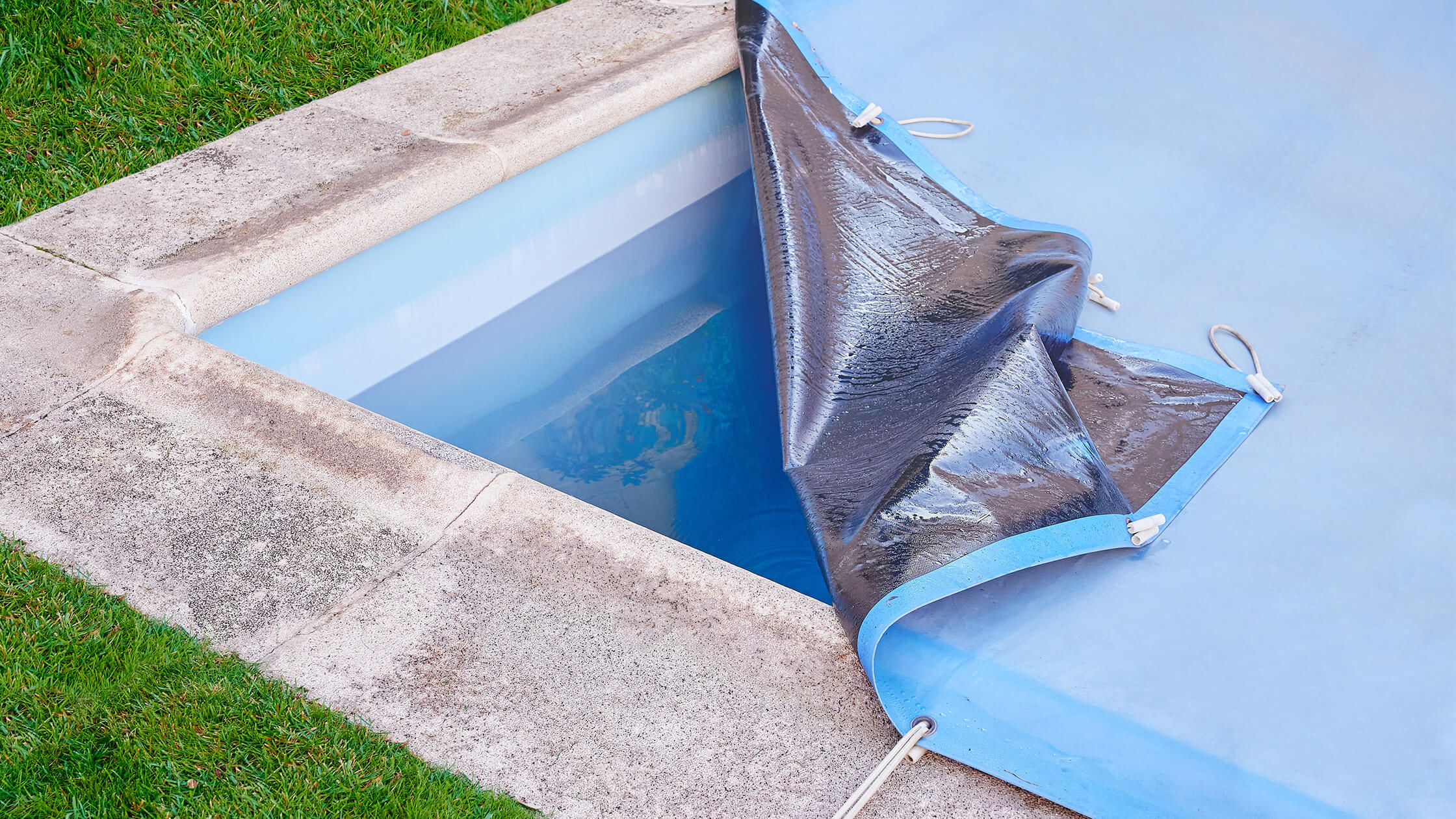 partially opened pool cover