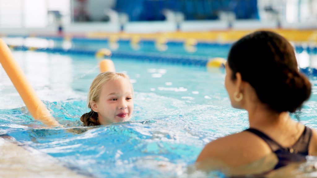 child attend a swimming lesson