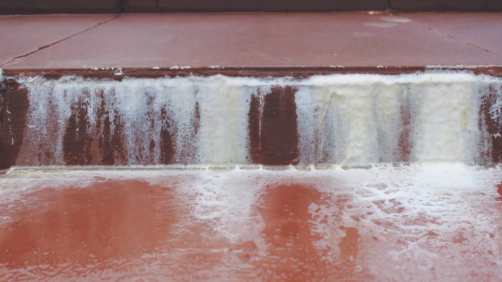 White calcium stains on the pool walls.